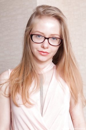 Nerdy teen Alexandra bares her small tits and pulling down her ripped jeans