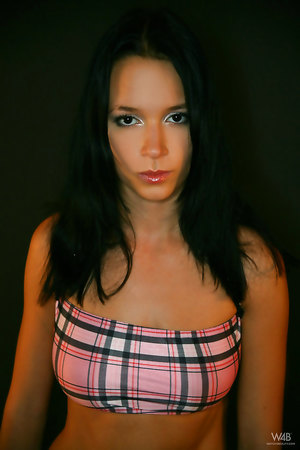 Brunette babe Gwen in sexy suit exposing her hairless pussy