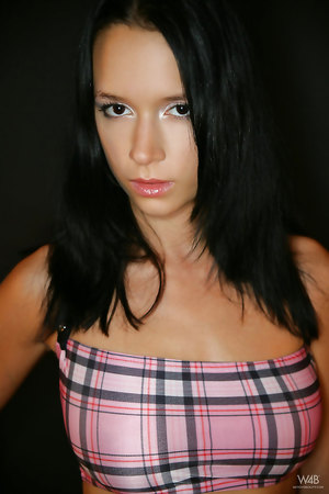 Brunette babe Gwen in sexy suit exposing her hairless pussy