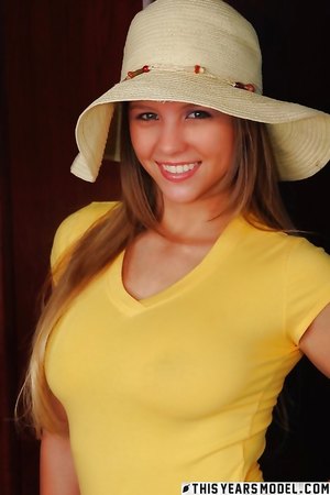 Sweet teen brunette Alaina Dawson smiles for the camera and shows her big tits