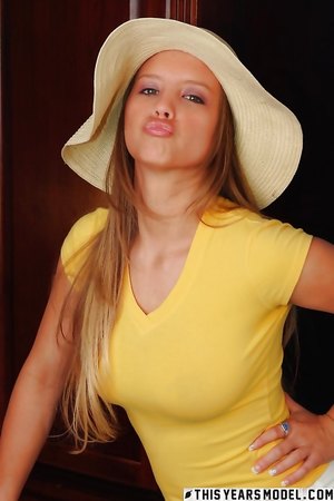 Sweet teen brunette Alaina Dawson smiles for the camera and shows her big tits