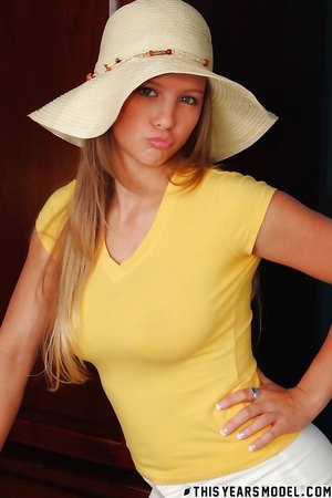 Sweet teen brunette Alaina Dawson smiles for the camera and shows her big tits