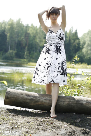Teen Lena showing her boobs and her coochie besides a lake in beautiful forest