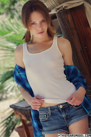 Teen with pigtails Bonnie Apricot in denim shorts flaunting her hairy pussy