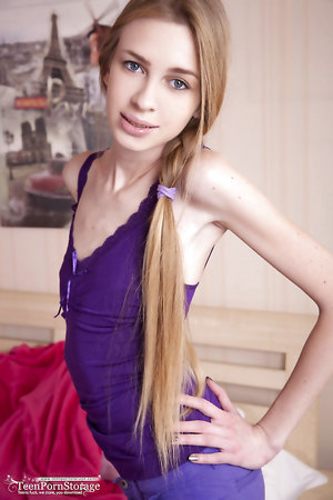 Horny slim bodied teen Ivanka shows off her tiny tits and shaved cooch wearing only socks