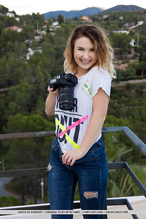 Curly photographer Anata removes tight jeans and a t shirt outdoors