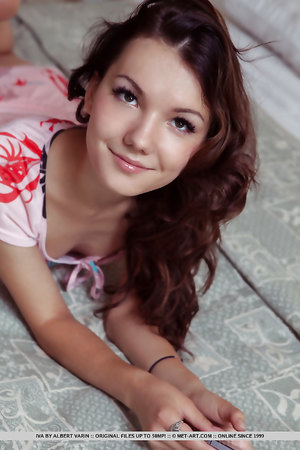 Sweet teen Iva teases with her slim curves and with meaty pussy lips