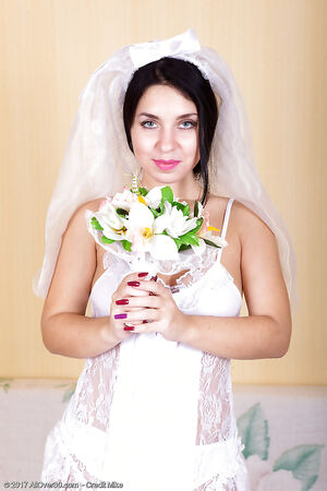 Mischievous bride Tanita lifts wedding gown to flash her furry cooch