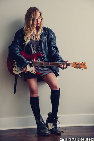 Indie rock chick Samantha Styles strips down to her stockings and guitar only