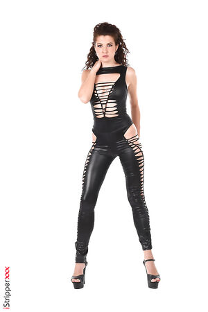 Curvy brunette Gia Ren posing in sexy ripped leather pants and high heels