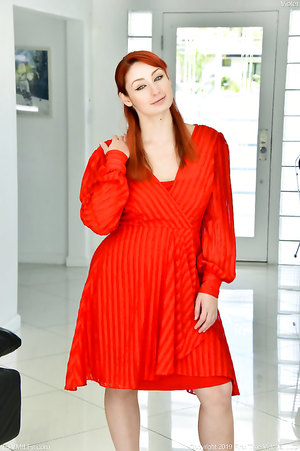 Blue eyed Redhead Violet Monroe exposes her bush under red dress