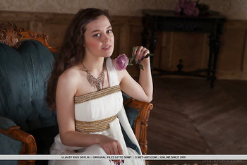 Ulia Voluptuously Undresses On The Couch Baring Her Unshaven Twat