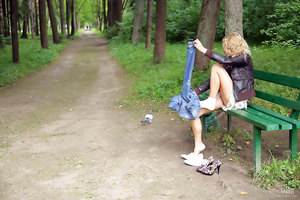 Stunning blonde Summer Breeze in ruffled mini skirt teasing in a park