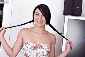 Flirty stunner with pigtails Megan Piper shoving a dildo up her creamy snatch