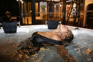 Gorgeous latina Kaley Jones with fake tits poses naked in the jacuzzi